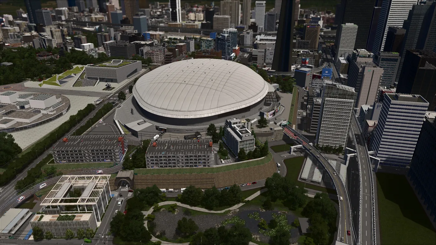 A domed stadium district surrounded by parks, office towers and an elevated rail line.